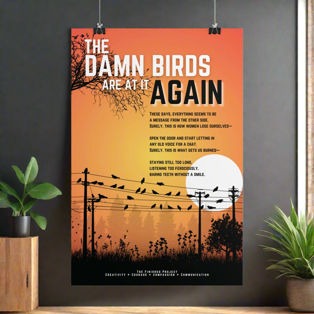 Poster with text 'The Damn Birds Are At It Again' and silhouette of birds on a wire against an orange sky.