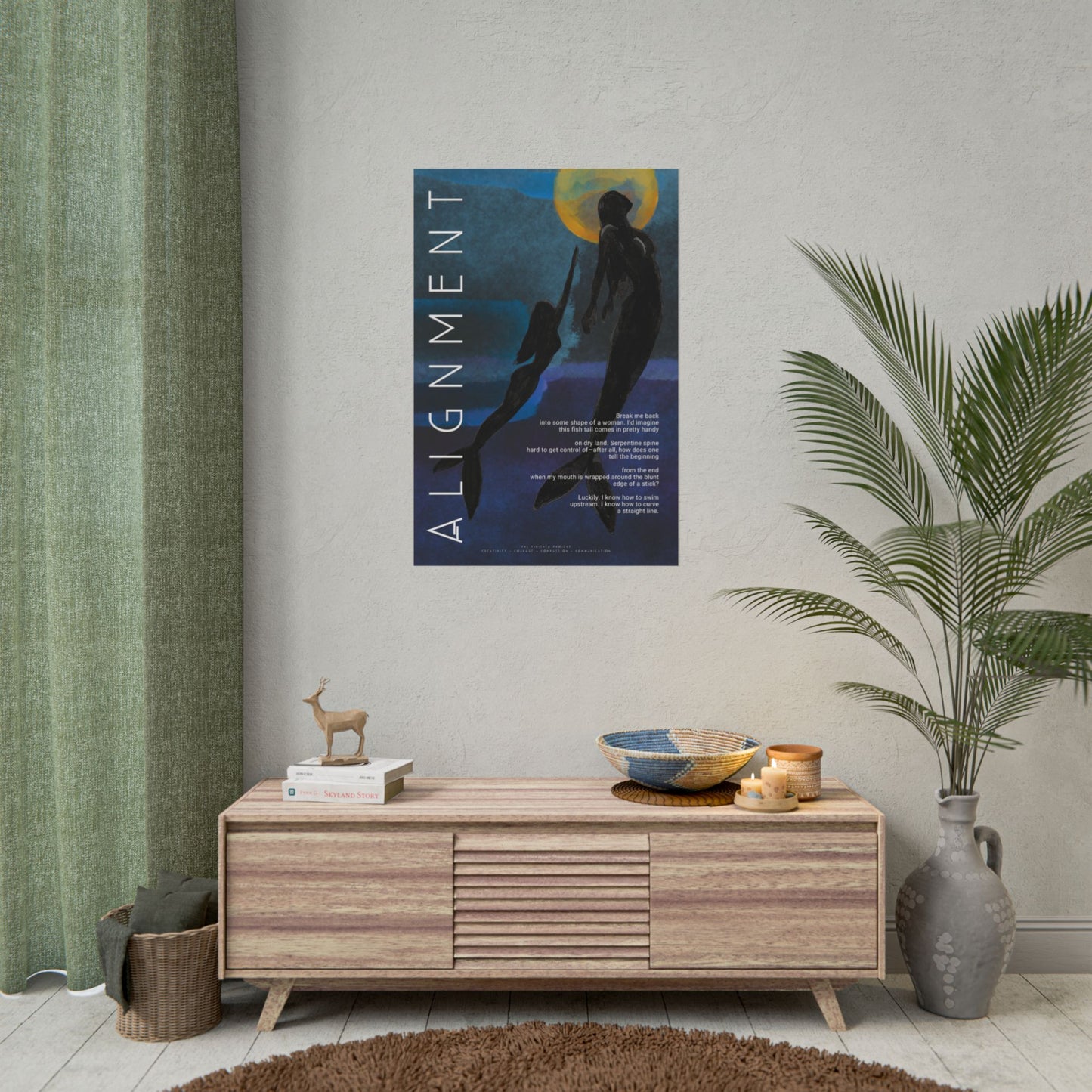 Poster titled 'Alignment' on a wall above a wooden cabinet with decor items.